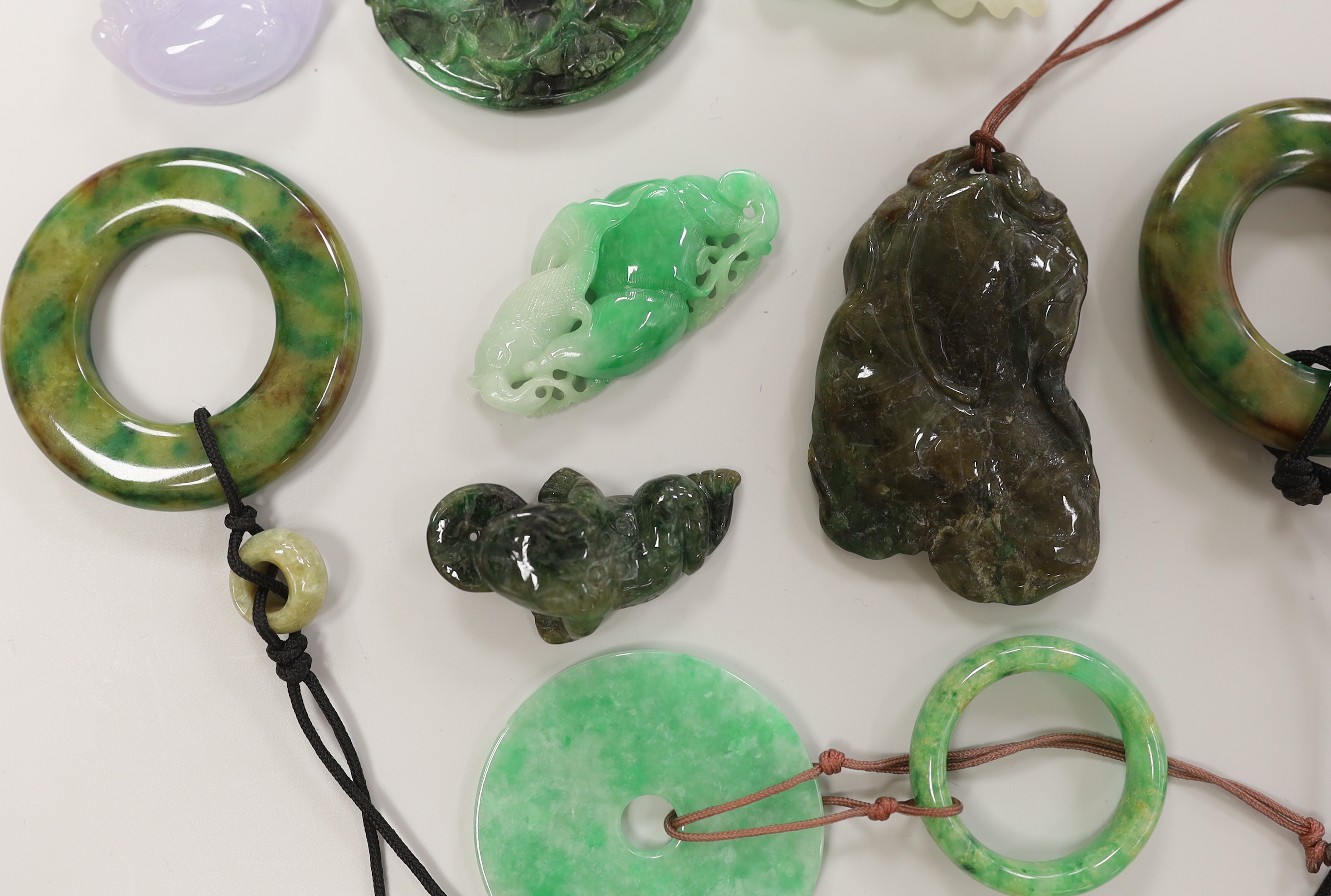 Eight assorted jade and hardstone carvings and pendants, largest 7cm long